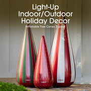 Three inflatable tree cones with colorful stripes on a wooden surface, labeled 'Light-Up Indoor/Outdoor Holiday Decor' by Funboy.